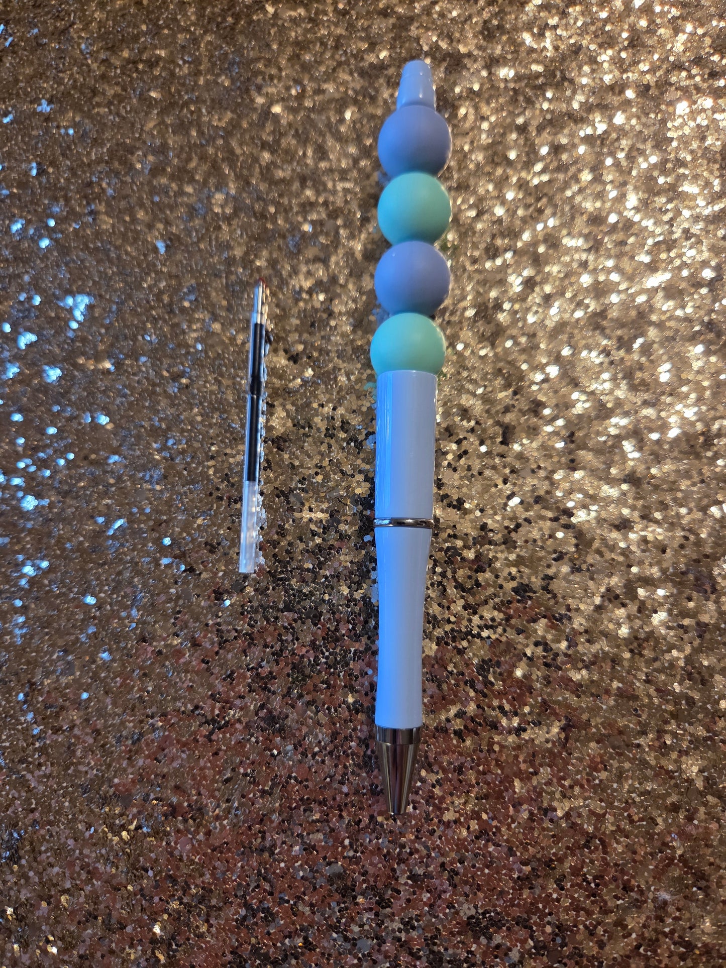 Blue and Teal Pen with one Ink Refill